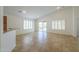 A spacious living room with tile flooring, shuttered windows and backyard access at 188 N Nueva Ln, Casa Grande, AZ 85194