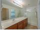 This ensuite bathroom features a large vanity with a sink and walk in shower at 188 N Nueva Ln, Casa Grande, AZ 85194
