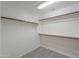This walk in closet is large with shelves and railing for ample storage at 188 N Nueva Ln, Casa Grande, AZ 85194