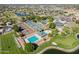 Spectacular aerial view showcasing the community pool, tennis courts, and golf course at 19277 N 78Th Ln, Glendale, AZ 85308
