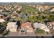 An aerial view of a beautiful home in a lush neighborhood near a golf course at 19277 N 78Th Ln, Glendale, AZ 85308