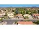 Aerial view of a home with mature landscaping in a well-kept neighborhood near a golf course at 19277 N 78Th Ln, Glendale, AZ 85308