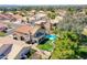 Aerial view showing houses with pools, patios, landscaped yards, and a glimpse of a community neighborhood at 19277 N 78Th Ln, Glendale, AZ 85308