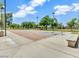 Community basketball court with well-maintained surfaces, lighting, benches and lush landscaping at 19277 N 78Th Ln, Glendale, AZ 85308