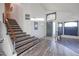 Bright entryway featuring modern staircase, stylish front door and clerestory window to let in natural light at 19277 N 78Th Ln, Glendale, AZ 85308