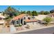 Aerial view of a well-maintained home with a three-car garage and mature trees at 19277 N 78Th Ln, Glendale, AZ 85308