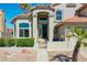 Inviting home featuring well-maintained landscaping, a charming front door, and a red tile roof at 19277 N 78Th Ln, Glendale, AZ 85308