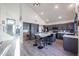 A well-lit kitchen featuring a central island with seating, modern appliances, and stylish gray cabinetry at 19277 N 78Th Ln, Glendale, AZ 85308