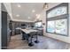 Sunlit kitchen features a large island, stainless steel appliances, and a view of the private pool at 19277 N 78Th Ln, Glendale, AZ 85308