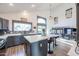 A bright kitchen with a large island, stainless steel appliances, and views of the backyard pool at 19277 N 78Th Ln, Glendale, AZ 85308