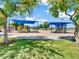 Community playground featuring modern play equipment, shaded structures and pristine landscaping at 19277 N 78Th Ln, Glendale, AZ 85308