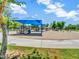 Playground area with swings, slides, and shade structure at 19277 N 78Th Ln, Glendale, AZ 85308