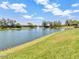 Picturesque community pond with a fountain, lush greenery, and tranquil scenery at 19277 N 78Th Ln, Glendale, AZ 85308