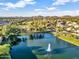 Beautiful pond with fountain surrounded by mature trees and well-maintained landscaping at 19277 N 78Th Ln, Glendale, AZ 85308