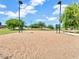 Community sand volleyball court with nets, lighting, benches and shady trees at 19277 N 78Th Ln, Glendale, AZ 85308