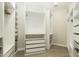 Walk-in closet featuring custom built-in shelving and drawers for optimal organization at 20802 N Grayhawk Dr # 1151, Scottsdale, AZ 85255