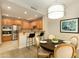 Eat-in dining area with modern lighting, seamlessly connecting to the stylish kitchen at 20802 N Grayhawk Dr # 1151, Scottsdale, AZ 85255