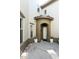 Inviting front entrance with potted plants and decorative rocks, adding a touch of elegance at 20802 N Grayhawk Dr # 1151, Scottsdale, AZ 85255
