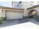 Attached two car garage, paved drive, and gated entrance, providing convenient parking and security at 20802 N Grayhawk Dr # 1151, Scottsdale, AZ 85255