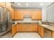 Kitchen with stainless steel appliances and light wood cabinets offering a modern look at 20802 N Grayhawk Dr # 1151, Scottsdale, AZ 85255