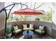 Outdoor patio with comfortable seating and sunshade, creating a relaxing and private retreat at 20802 N Grayhawk Dr # 1151, Scottsdale, AZ 85255