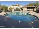 Community pool surrounded by desert landscaping, providing a refreshing escape at 20802 N Grayhawk Dr # 1151, Scottsdale, AZ 85255