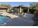Lounge chairs by the pool and the cabana invite you to relax and enjoy the pool area at 20802 N Grayhawk Dr # 1151, Scottsdale, AZ 85255