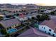 Beautiful aerial view of the home featuring a pool, backyard, and nearby neighborhood at 21030 E Misty Ln, Queen Creek, AZ 85142