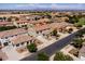Areal shot of a stunning home nestled in a Gathering-friendly neighborhood with beautiful landscaping and convenient amenities at 21030 E Misty Ln, Queen Creek, AZ 85142