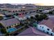 From above, discover this backyard haven, complete with a pool, entertainment spaces, and mountain views at 21030 E Misty Ln, Queen Creek, AZ 85142