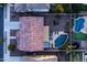 Aerial view shows a backyard featuring a pool, patio furniture, and manicured landscaping at 21030 E Misty Ln, Queen Creek, AZ 85142