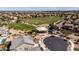 Aerial view of a green community park, playground and surrounding homes at 21030 E Misty Ln, Queen Creek, AZ 85142