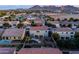 This aerial image highlights the home's backyard, complete with a pool and mountain backdrop at 21030 E Misty Ln, Queen Creek, AZ 85142