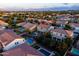 Beautiful aerial view of the home featuring a pool, backyard, and nearby neighborhood at 21030 E Misty Ln, Queen Creek, AZ 85142