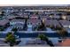 Aerial shot shows the home nestled in a residential neighborhood with mountain views in the distance at 21030 E Misty Ln, Queen Creek, AZ 85142