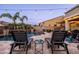 Relaxing backyard offers a sparkling pool, lounge chairs, and ambient string lights at 21030 E Misty Ln, Queen Creek, AZ 85142