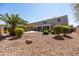 Spacious backyard with desert landscaping, mature trees, a covered patio, and a refreshing pool at 21030 E Misty Ln, Queen Creek, AZ 85142