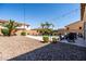 Large backyard with a refreshing pool, desert landscaping, an outdoor dining area, and mature trees at 21030 E Misty Ln, Queen Creek, AZ 85142