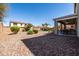 Well-maintained backyard with desert landscaping, pool, covered patio, and plenty of room for outdoor activities at 21030 E Misty Ln, Queen Creek, AZ 85142
