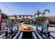 Inviting backyard pool with a fire pit and comfortable lounge chairs perfect for entertaining or relaxing outdoors at 21030 E Misty Ln, Queen Creek, AZ 85142