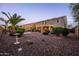 Large backyard with desert landscaping, string lights, and outdoor dining space at 21030 E Misty Ln, Queen Creek, AZ 85142