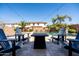 Inviting backyard featuring a pool, lush landscaping, patio seating, and an outdoor living area at 21030 E Misty Ln, Queen Creek, AZ 85142