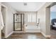 Bathroom featuring a glass shower, soaking tub, and natural light from the window at 21030 E Misty Ln, Queen Creek, AZ 85142