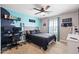 This bedroom is equipped with gamer-themed decor, carpet flooring, and a ceiling fan at 21030 E Misty Ln, Queen Creek, AZ 85142