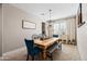 Charming dining room featuring a wooden table, elegant seating, and stylish decor for memorable gatherings at 21030 E Misty Ln, Queen Creek, AZ 85142