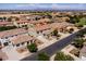 Delightful two-story house with a cozy front porch and manicured landscaping at 21030 E Misty Ln, Queen Creek, AZ 85142