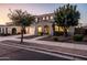 Attractive home with a well-maintained front yard, a two-car garage, and a welcoming entrance at 21030 E Misty Ln, Queen Creek, AZ 85142
