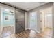 Hallway with wood flooring featuring a gray sliding barn door at 21030 E Misty Ln, Queen Creek, AZ 85142