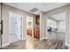 Hallway with views to a bathroom, living space, and office at 21030 E Misty Ln, Queen Creek, AZ 85142