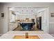 Open-concept kitchen with a center island, pendant lighting, and seamless integration with the dining area at 21030 E Misty Ln, Queen Creek, AZ 85142